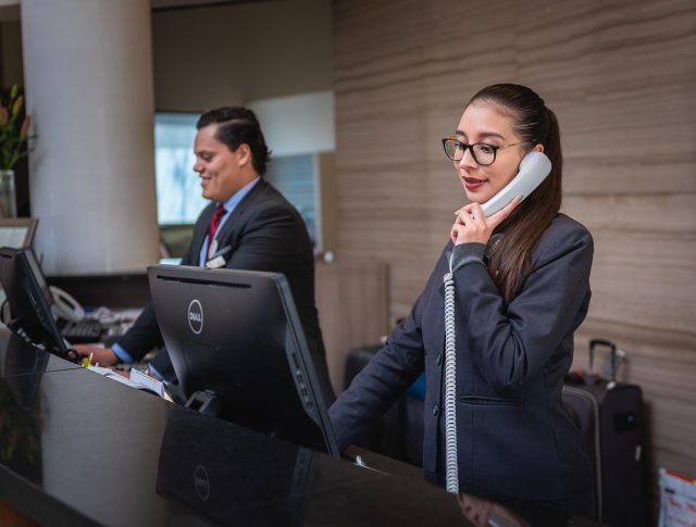 receptionists, phone call, hotel, reception, woman, man, work, attention, lobby, employees, professional, company, assistance, hotel, hotel, hotel, hotel, hotel, reception