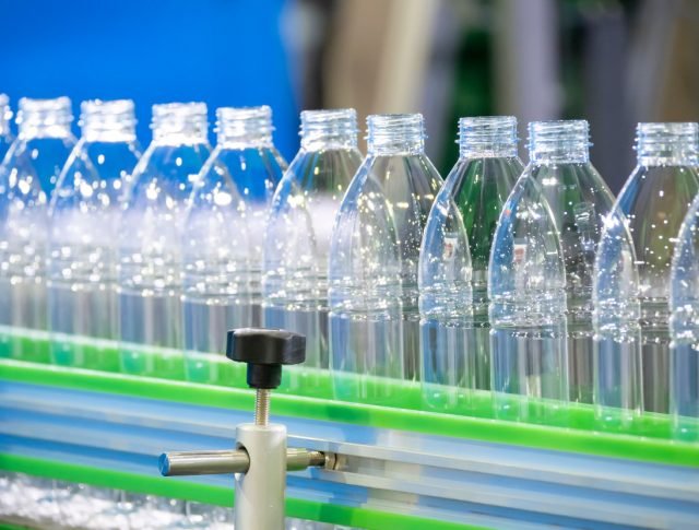 the,pet,bottles,in,the,rail,on,the,conveyor,belt